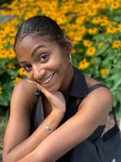 Iyana and yellow flowers